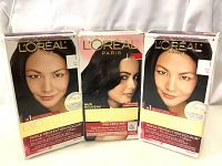 Front view of three L'Oreal Excellence Creme hair dye boxes in shade J Black