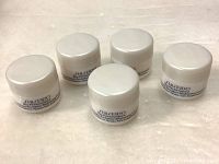 Five white jars of Shiseido Bio Performance Advanced Super Revitalizer Brightening Formula facing forward showing product name.