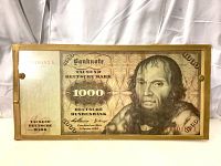 Full view of the large 1960 German 1000 Deutsche Mark banknote featuring Johannes Schoner with some signs of aging in glass and gold frame.