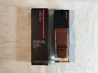 Photo of product bottle and packaging showing front label and bottle design