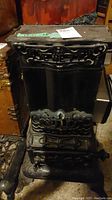 Front view of the Jewett cast iron stove showing overall design and embossed name.