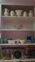Full shelving unit showing all ceramic vases, glassware, planters, jars and tins