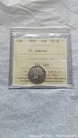 Photo of the 1891 Canadian 10 cent dime coin graded VG-8 with 22 Leaves variety and certification number visible.