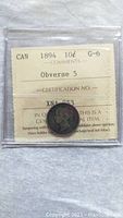 1894 Canadian ten cent silver coin graded G-6 with Obverse 5, in plastic holder with grading label.
