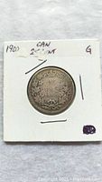 Reverse side of the 1900 Canadian 25 cent coin showing denomination, year, crown and wreath design.