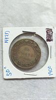Reverse side of 1900 Newfoundland 50 cent silver coin showing denomination '50 CENTS' and year '1900' with decorative border.