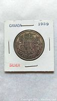 Obverse side of the coin showing the Canadian coat of arms with date 1939 and 'CANADA' inscribed.