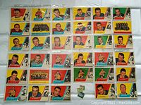 Front sides of 35 1963 Topps baseball cards laid out, showing player portraits and team images with vibrant colored backgrounds