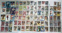 Photo of front sides of 86 hockey cards laid out in rows showing various players and designs.