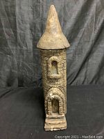 Front view of the castle statue with detachable cone top on