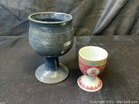 Photo showing the vintage dark glazed ceramic goblet and the ceramic egg cup with red, gold, and Chinese motif.