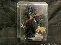Darth Vader figure with accessories in plastic blister pack, showing front view of figure and accessories