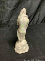 View of statue from the back showing the couple's embrace and the base