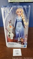Elsa and Olaf dolls displayed in original packaging showing front view with Frozen 2 branding.