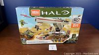 Front view of Mega Construx Halo Infinite Defense Point Showdown box showing main model and included figures.