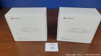 Two unopened white boxes labeled Teckin SL07 Smart Light Strips sitting side by side.