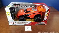 Maisto Tech Dune Blaster RC offroad truck in original box with remote control visible.