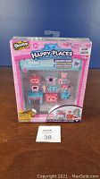 Front view of Shopkins Happy Places Dreamy Bear set in packaging showing nine miniature furniture and character pieces.