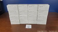 Lot of 16 boxes of Teckin Smart Plugs SPN10 stacked, each box contains 2 plugs.