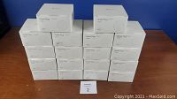 Stack of 18 white boxes labeled Smart Plug SPN10, each box likely containing 4 smart plugs