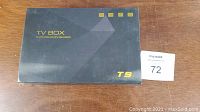 Closed black box with T9 TV Box printed on front, stating 4x CPU Cortex-A53 and GPU Mali-450MP2