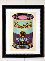 Full view of framed lithograph showing brightly colored Campbell's Tomato Soup can in Warhol's pop art style.