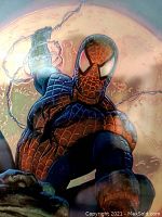 Close-up of Spider-Man in the ChromArt print showing detailed chrome coloring and full moon.