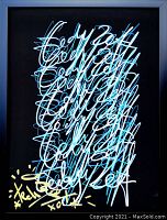 Full view of framed artwork showing mostly black background with layered light blue and white script, artist signature in gold at lower left.