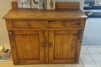 Front view showing two drawers and two-door cupboard