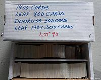 Box with handwritten label detailing the lot contents of 1400 sports cards separated into Leaf 800 cards, Donruss 300 cards, and Leaf 1987 300 cards.