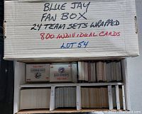 Open box showing clearly labeled Dividers and stacks of baseball cards, two visible sealed Blue Jay team sets titled 'Elite Prospects 1985-1992' and 'Great Moments 1985-1992'.