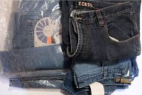 Photo of five pairs of new men's jeans size 40, showing Xebec brand on one pair and other jeans folded with labels visible.