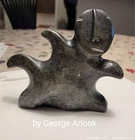 Front view of the soapstone Inuk carving showing overall shape and form