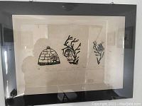 Front view of framed stonecut print showing all three vignettes.