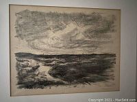 Framed and matted charcoal landscape sketch showing dark cloudy sky and river or coastline.