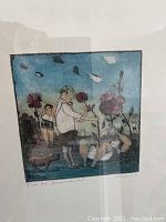 Close-up front view of the lithograph print showing figures with flowers and animal, with artist signature and edition number visible.