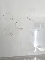 Close-up of the drawing showing five polar bears with fine pen details and red accents on faces