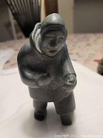 Angle view of the front left side showing the hood and clenched fists.