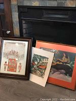 Group view showing framed antique print, partially visible framed Paul Gauguin print, and loose print ready for framing