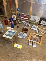 Overview of the patriotic memorabilia collection including wall art, books, decorative stars, pottery, and framed prints.