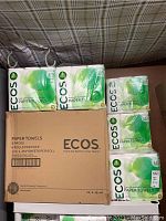 Multiple ECOS 6-packs stacked with cardboard box