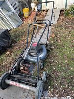 Photo showing Craftsman Quiet Cut push reel mower with visible wheels and handle