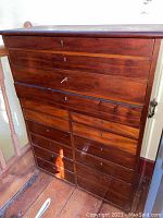 Front view showing four top drawers and twelve bottom drawers