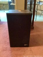 Front view of one speaker showing fabric grille and JVC branding at bottom right