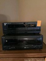 Front view of Ion tape player on top and Technics CD player below, showing controls, cassette decks, and disc tray