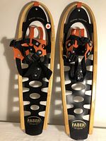 Pair of Faber Winter Leisure snowshoes side by side showing full front view with bindings and branding