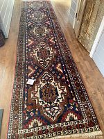 Full-length view of the runner rug laid on wood floor