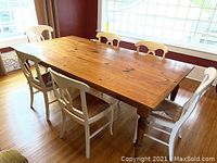 Overview of pine table and six chairs in dining room setting