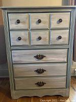 Full frontal view of the dresser showing five drawers and metal handles