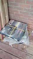Boxed CVP Strength bumper plate set outdoors on porch